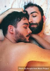 Two topless men cuddling 0LWZEb