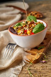 Bright vegetables with lentils and spinach in bowl