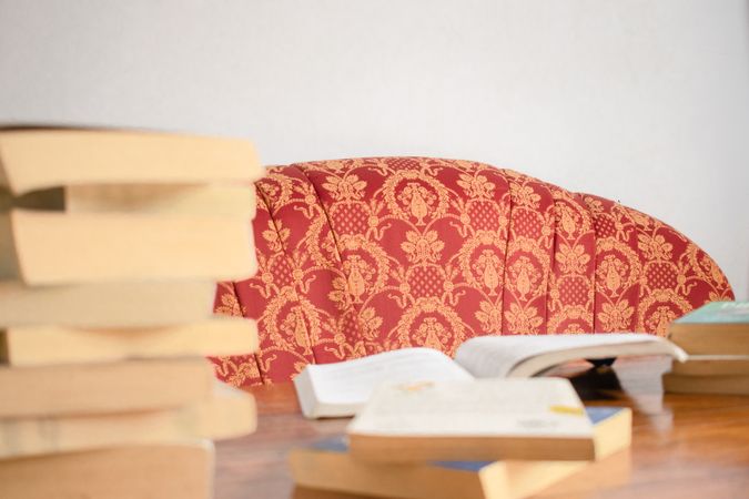 Asian young student study, reading and writing sit on sofa at living room