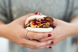 Woman holding Asian snack food