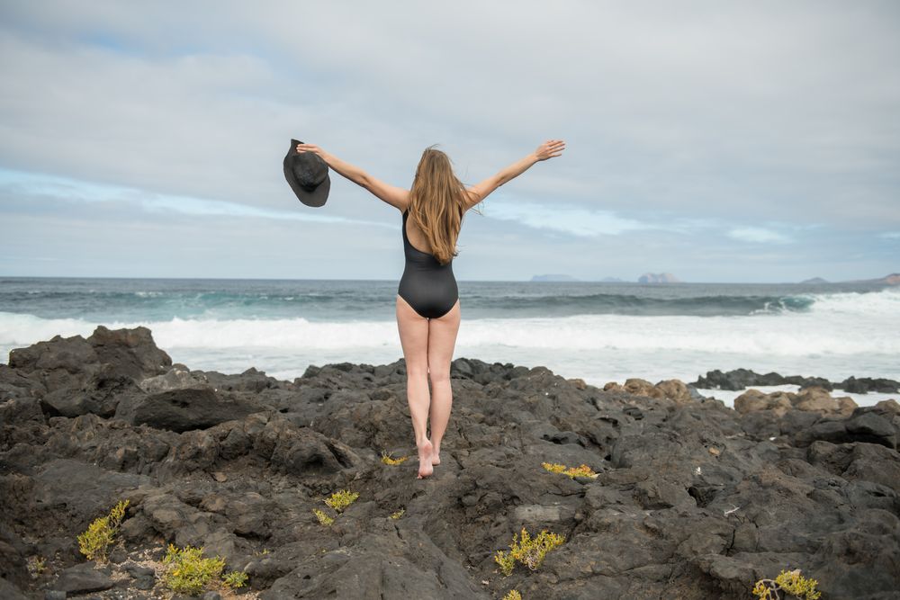 Sensual female near stormy sea