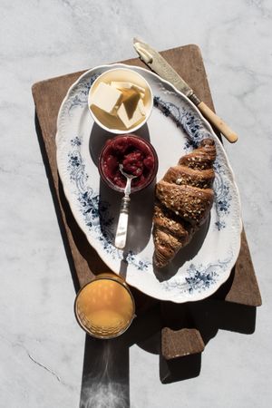 Served breakfast meal with sandwich and jam