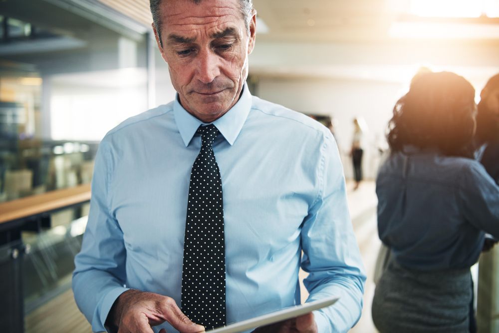 Portrait of businessman with tablet