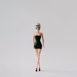 Doll in dress with skull head