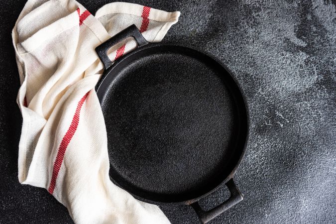 Empty cast iron pan as a table setting concept