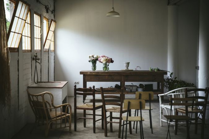 Bunches of flowers in vases on table