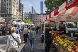 People walking through a farmers market