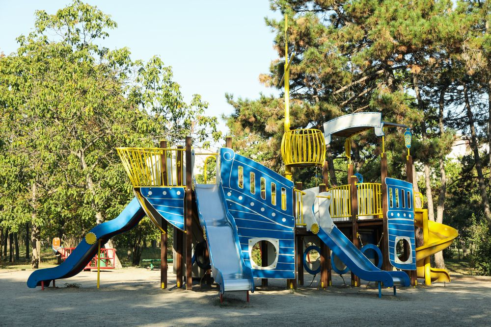 Playground in city park in sunny morning