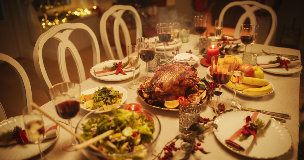 Close Up of a Delicious Turkey Roast with Baked Potatoes on a Festive Table.