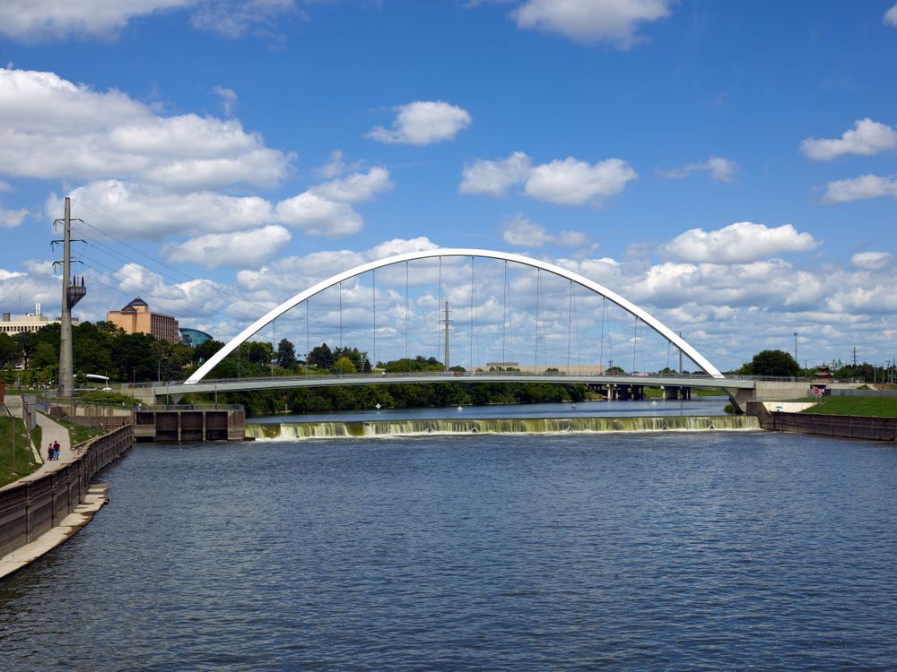 Falls cascade below the Iowa Women of Achievement Bridge, Des Moines, Iowa