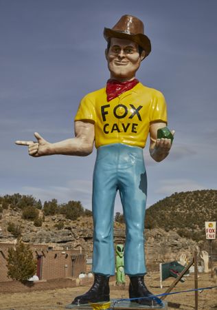 An oversized statue of a man at Fox Cave in Ruidoso, New Mexico