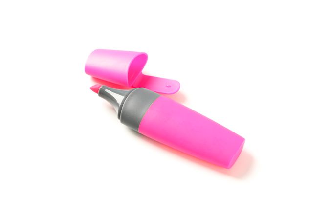 Color office highlighter isolated on plain background
