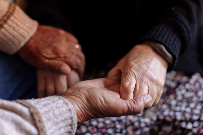 Detail of the hands of an mature couple