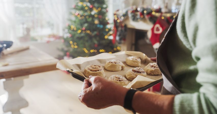Close Up of a Older Female Preparing Making Cinnamon Buns for Christmas at Home.
