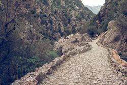 Rocky ravine with empty stone pathway in Mallorca