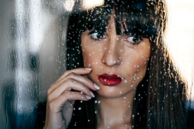 Stylish woman kissing glass