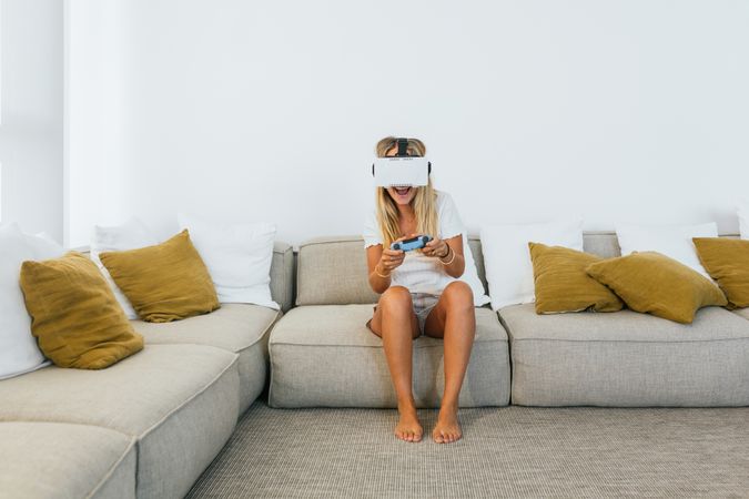 Woman in VR headset playing videogame
