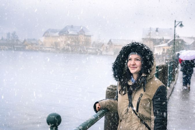 Smiling woman while snowing