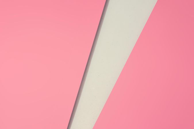 Pink paper with light geometric cut out