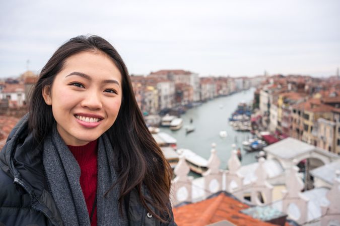 Content Asian female tourist at old city with waterlines