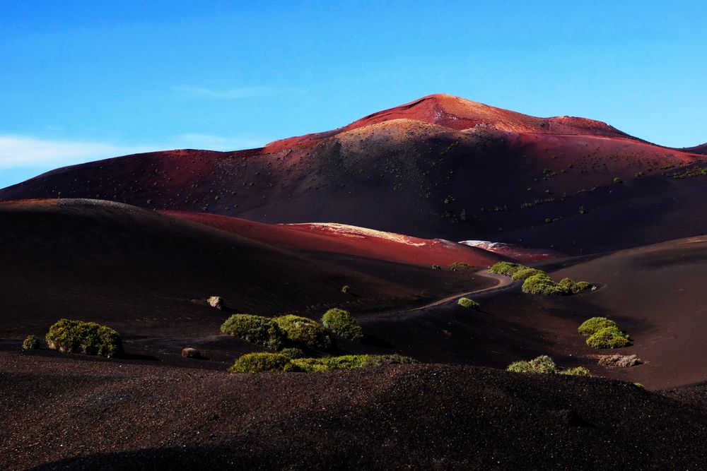 Picturesque view of volcanic terrain with solidified lava in wild area