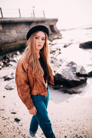 Portrait of a young woman walking on the beach