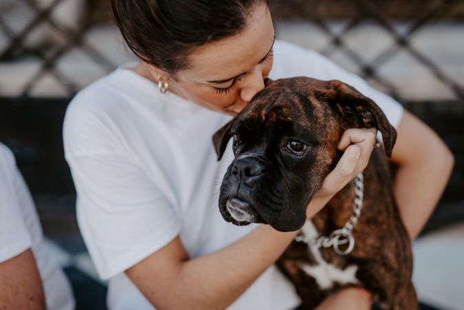 Young woman hugging with spot dog