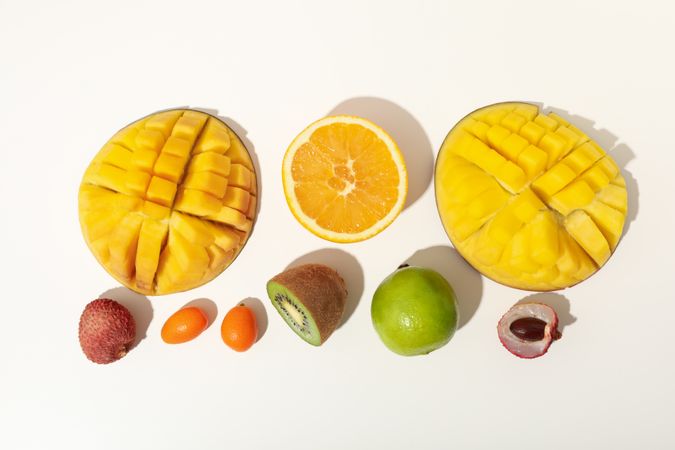 Set of tropical fruits on plain background, top view