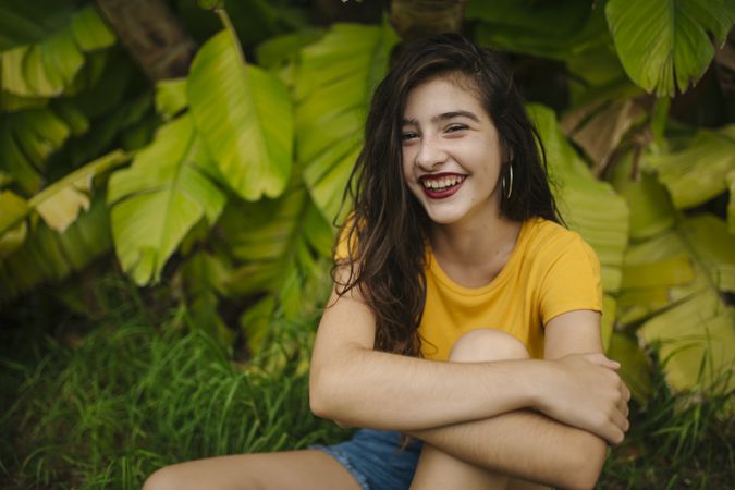 Dreamy female near tropical bush