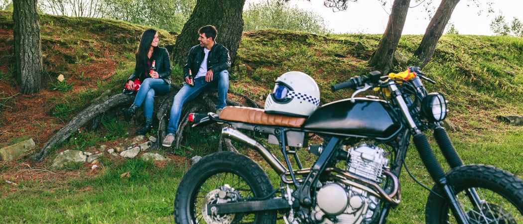 Couple resting from a motorcycle trip