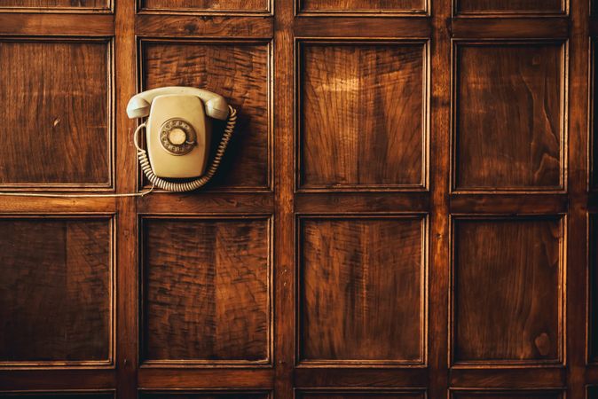 Retro phone hanging on wall