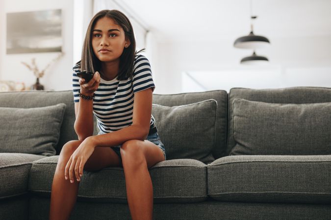 Girl sitting in relaxed mood watching television