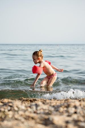 Young girl on beach shore