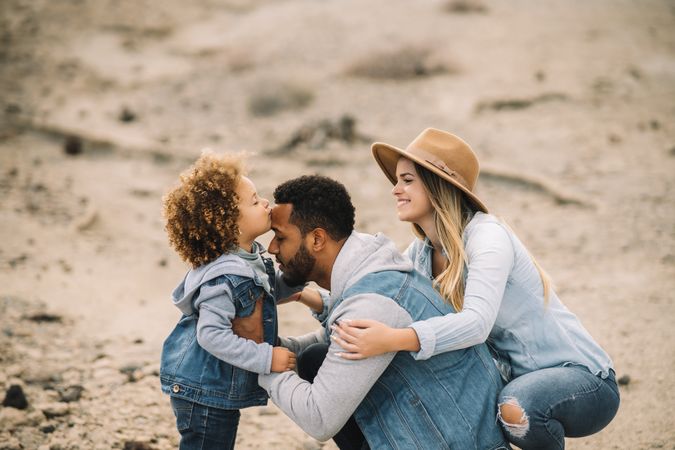 Happy multiethnic family gathering on nature