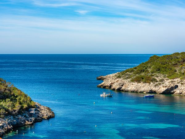 Cala Portinax bay with beautiful azure blue sea water