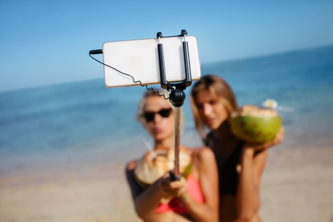 Friends taking selfie on beach
