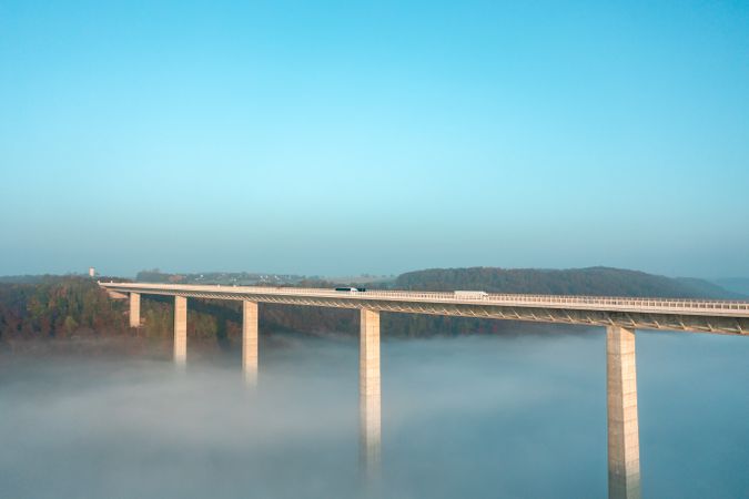 German tallest highway bridge in a foggy scenery, drone aerial view in Germany
