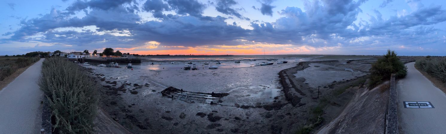 Panoramic of wreck and walkway before the Port de Loix, France