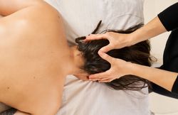 woman gives a head massage to relax and relieve stress