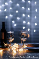Wine glasses with lights in background 5qkzwb