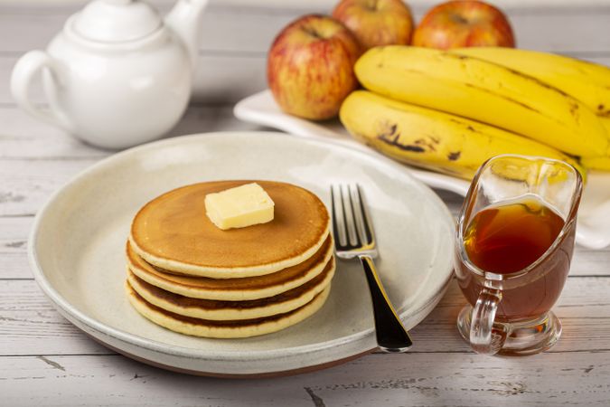 Delicious pancakes with butter and honey.
