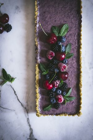Fresh blueberry pistachio cake with whole berries on top