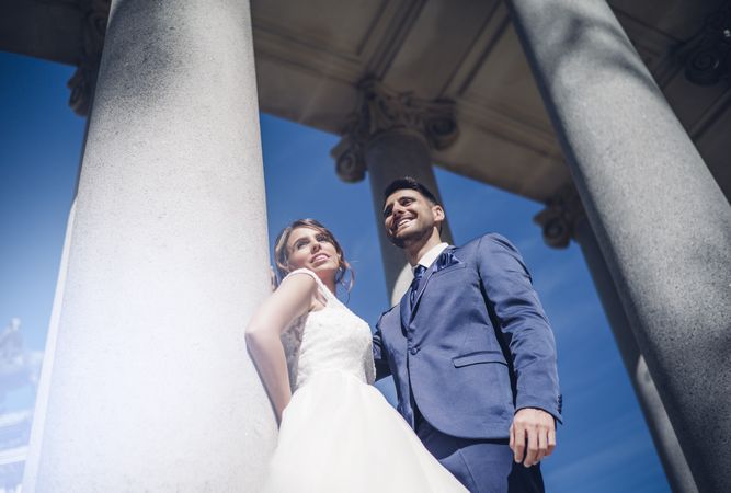 Newlyweds near columns