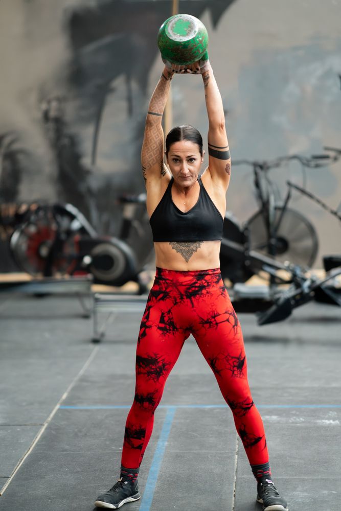 Woman with kettlebell above head