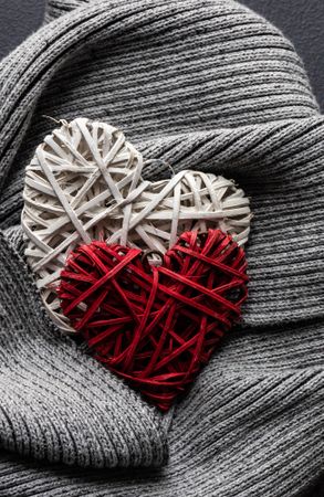 Thatched heart decorations on grey knit