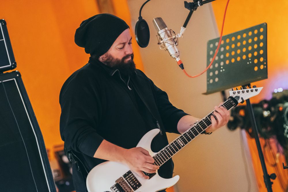 Musician playing guitar and singing