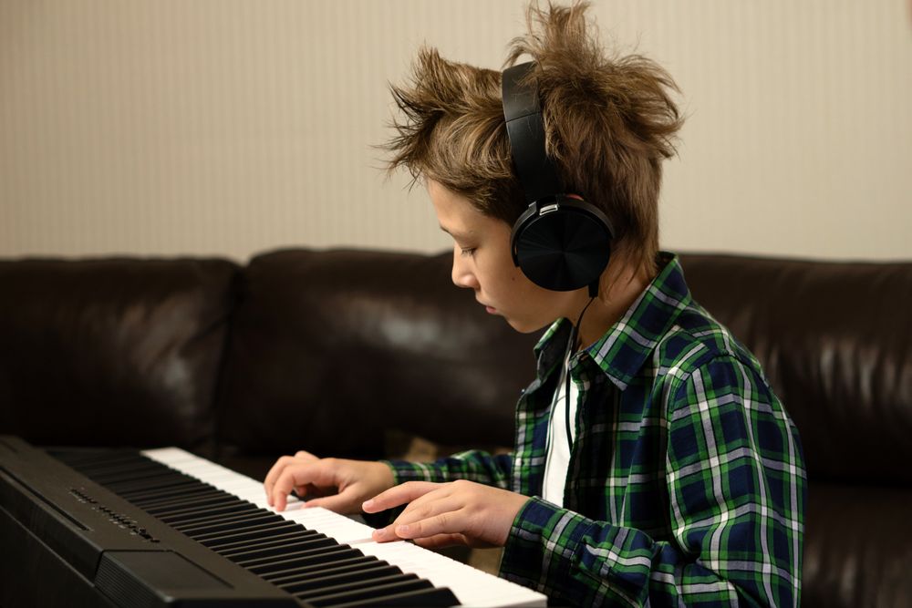 Focused Child Playing Piano