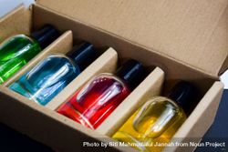 Four different perfume bottles in a cardboard box 5kRm3A
