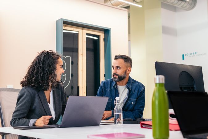 Group of multiracial people working with laptop in a coworking