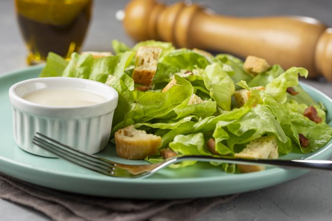 Caesar salad with croutons and bacon.